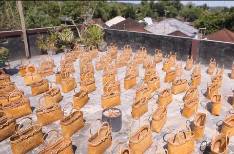 The authentic Bali rattan bags sold by Ganapati Crafts Co. are currently being dried under the sun.