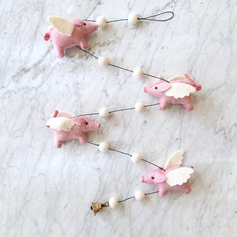 Flying piggy garland for kid's room designed by Ganapati Crafts Co. in Florida