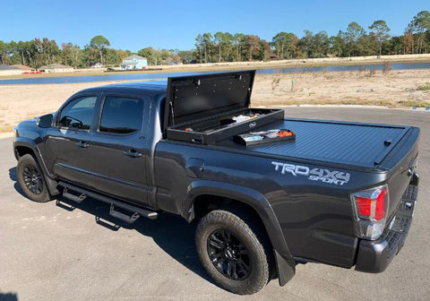 Toyota Tacoma with a retractable tonneau cover and toolbox.