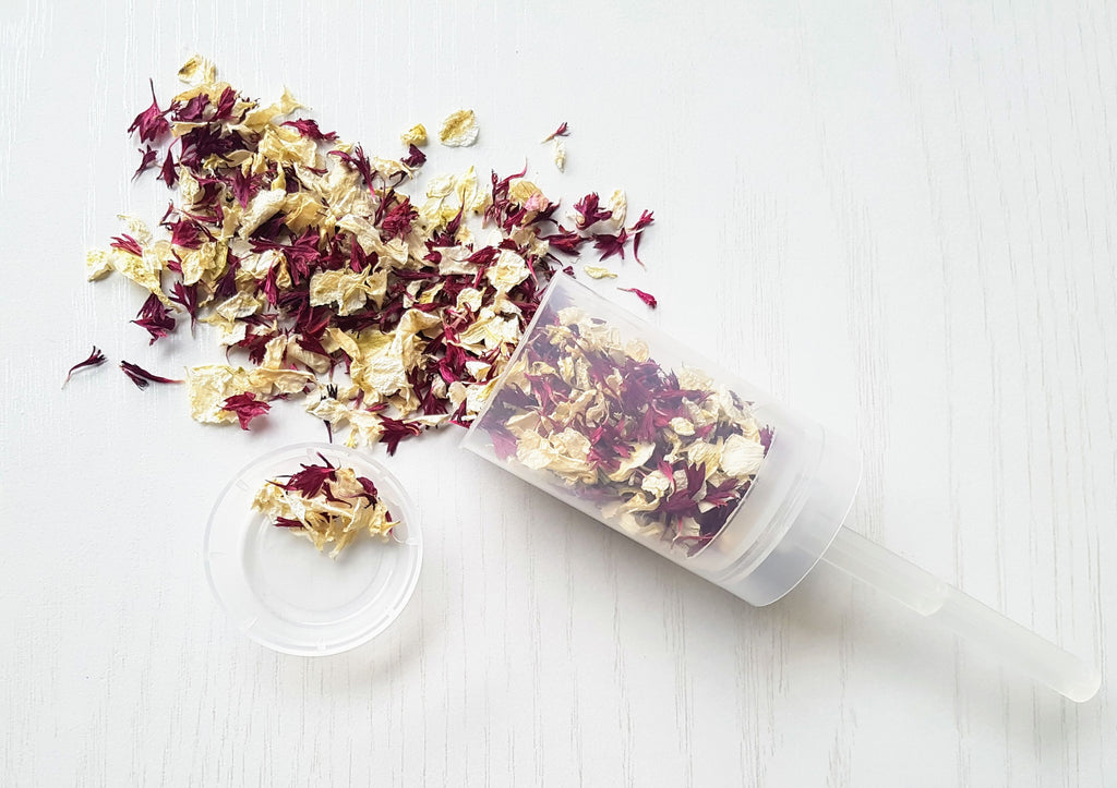 Wedding confetti poppers filled with delphinium petals