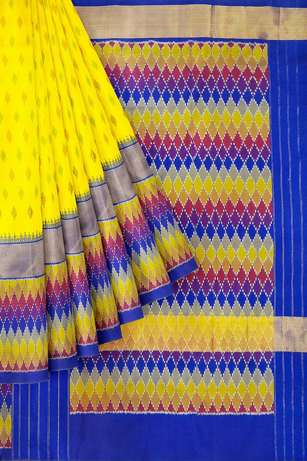 Handwoven Ikat pure silk saree in yellow with leaf motifs and a zari border.