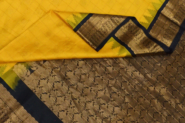 Gadwal pure silk saree in yellow with checks & gold motifs and a temple border