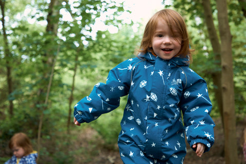 boy wearing mussy puddles blue ecowarm snowsuit