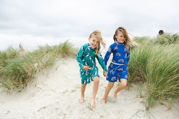 girls playing on the beach