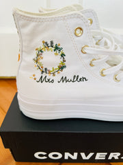 sides of embroidered converse in shades of green and gold in a wreath effect with gold sequins