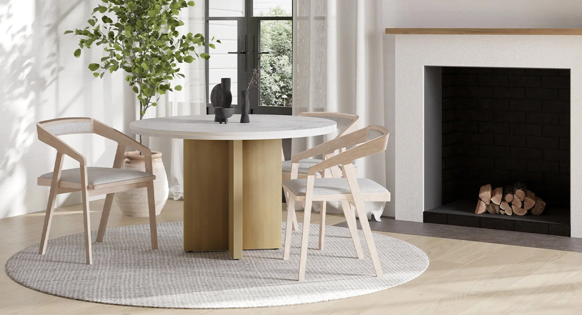 Dining table and chairs in front of fireplace