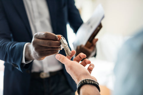 real-estate-agent-handing-over-keys