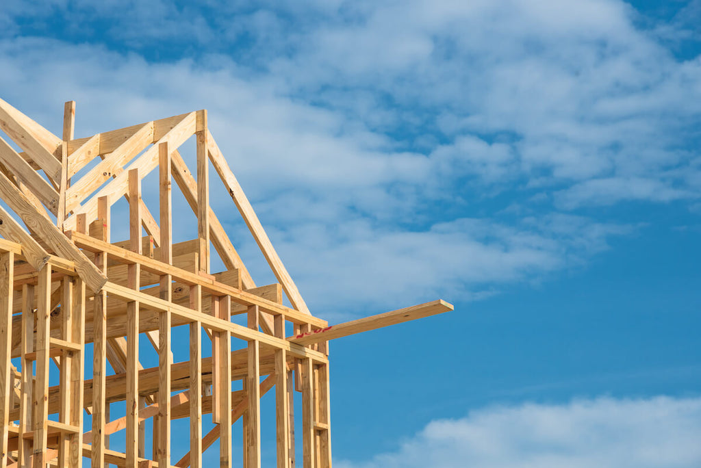 How much does it cost to build a custom home: wooden frame of a house