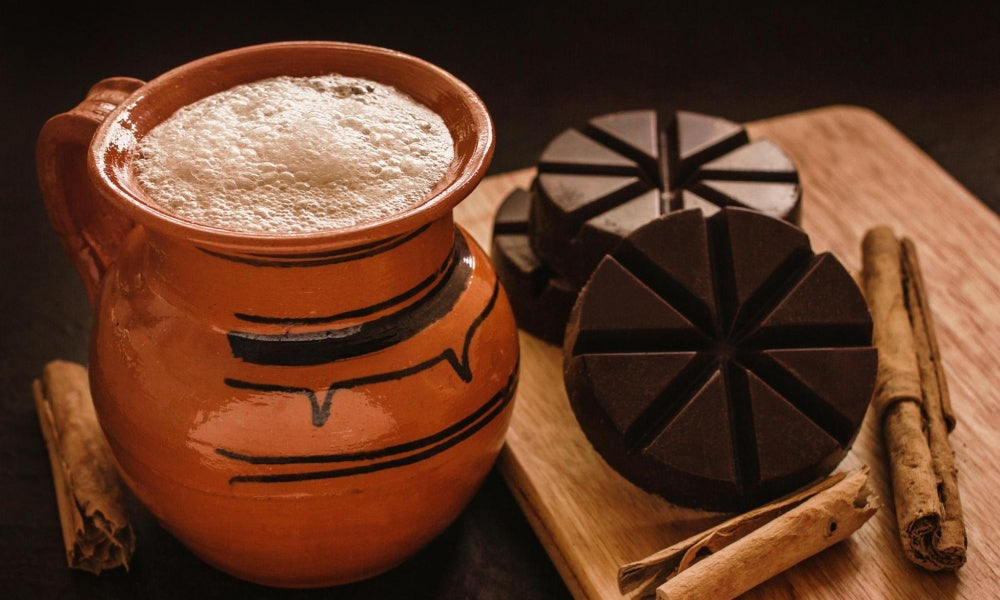 Hot cocoa as prepared by xocolatl aztecs in a clay pot