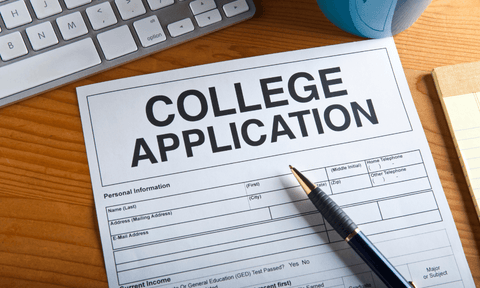 A blank college application form lying on a desk