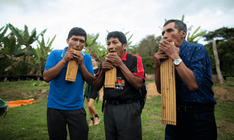 Three men in Central America play the syrinx (bamboo pipes)
