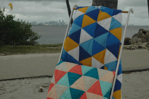 two raindance quilts together outstide at the beach