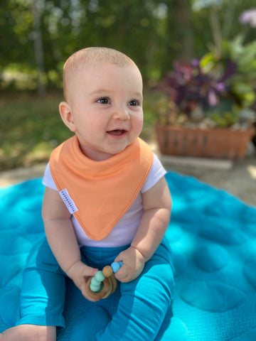 baby outside wearing a bandana size bib