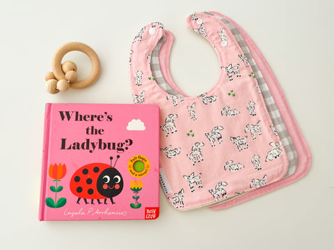 Pink lamb baby bib set with a baby flap book called where’s the ladybug