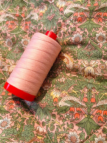 pink thread on liberty of london fabric