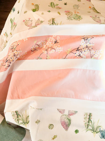 pink, green, succulent, and cherry blossom fabric on baby girl quilt
