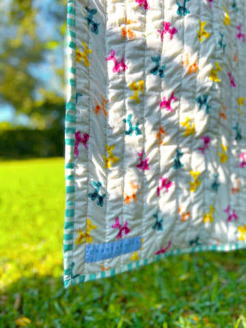 modern baby girl quilt hanging outside