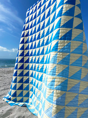 Blue and Yellow Quilt on Beach