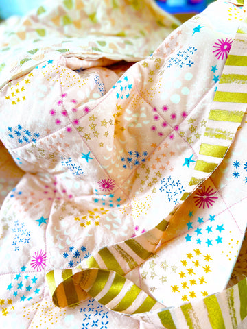 Gold Striped Fabric on Rainbow and Star Quilt