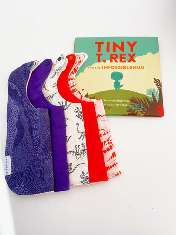 T. rex book and Dino baby bibs