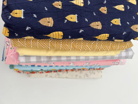 Baby bib fabrics stacked on top of each other