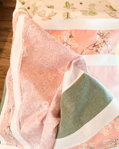 pink and green floral baby quilt top