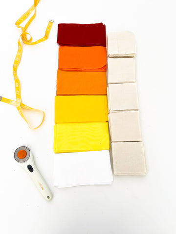 color palette for baby quilt with red, orange, yellow, white, and cream