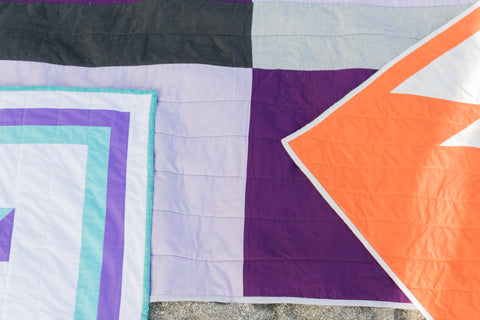three kids quilts laying on top of each other