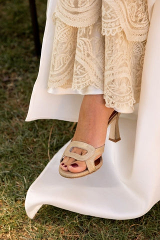 Bride with lace and thin-heeled sandals