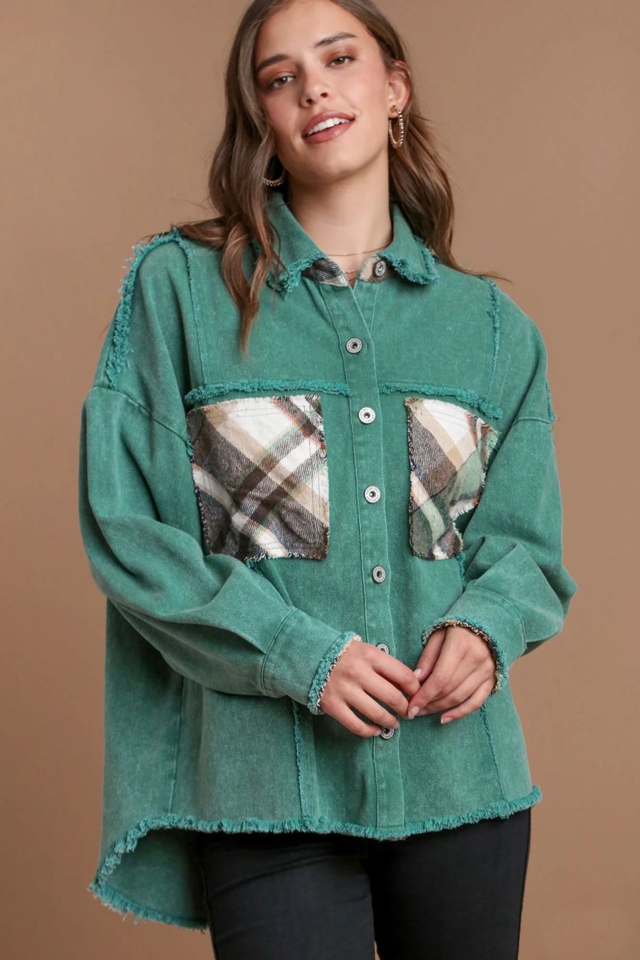 Woman wearing green denim jacket with patchwork pockets