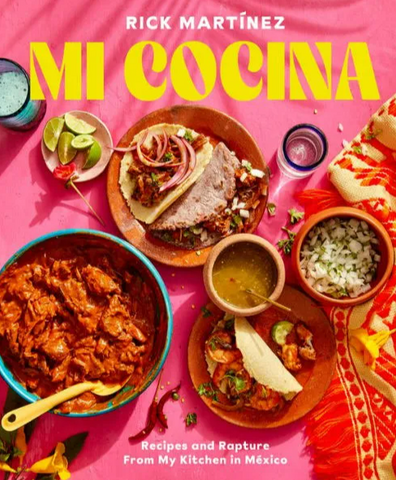 A pink tablecloth covered in delicious Mexican dishes