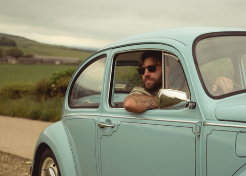 Handsome beard man in a car after using beard products