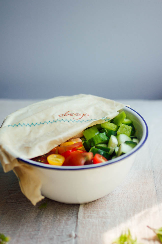 bowl of salad covered with reusable beeswax food wrap