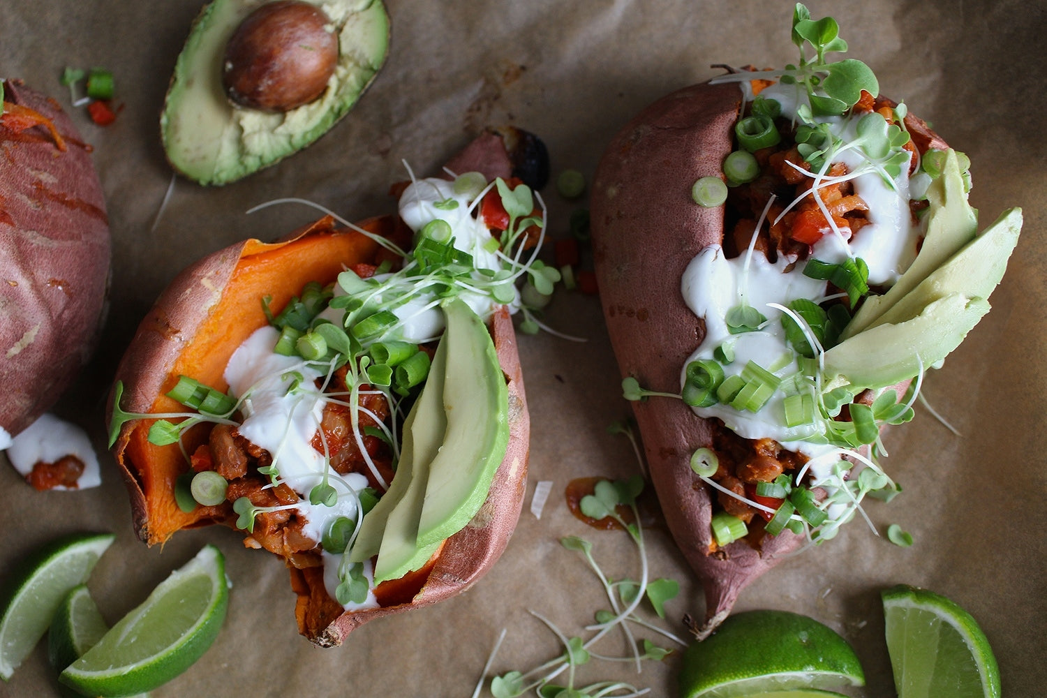 Stuffed sweet potatoes with sour cream, avocados, sprouts 