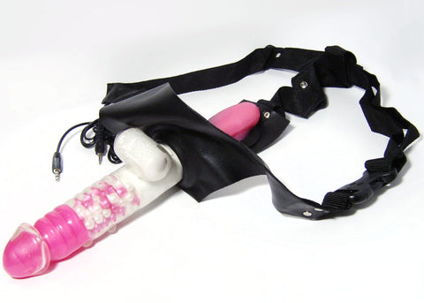 A 2-strap harness with a multi-function dildo with bullet vibrator and vibrating egg for internal use