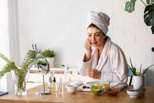 Woman at home doing skin care routine and self-care practices