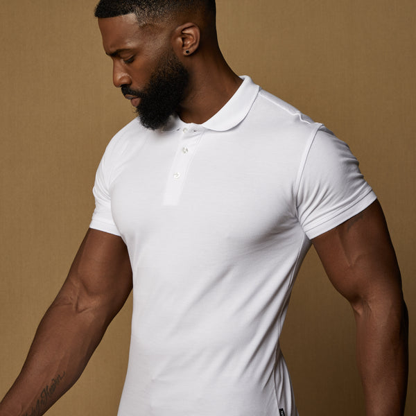 white tapered fit polo shirt showing the unique v tapered cut
