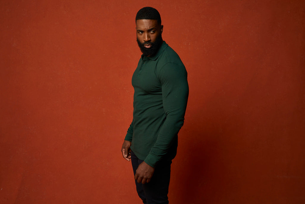 green fitted polo shirt being work untucked at Tapered Menswear