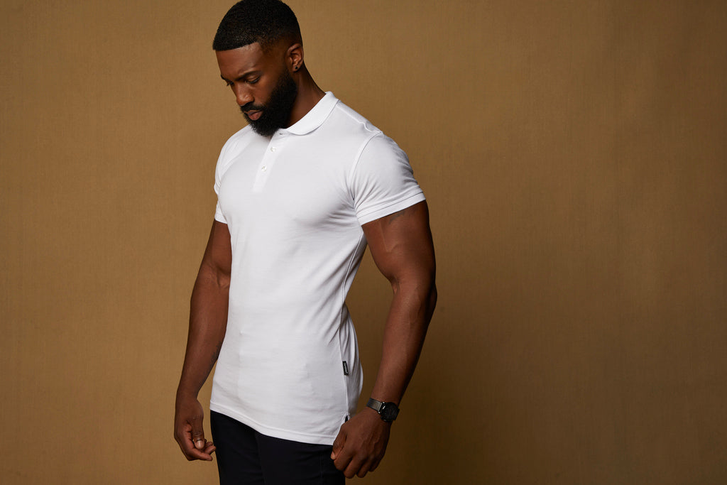 white fitted polo shirt being work untucked at Tapered Menswear