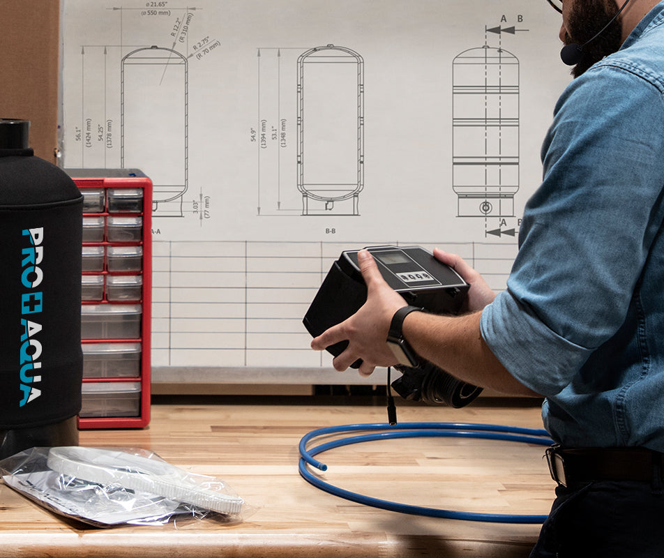 Man tinkering with water softener display head