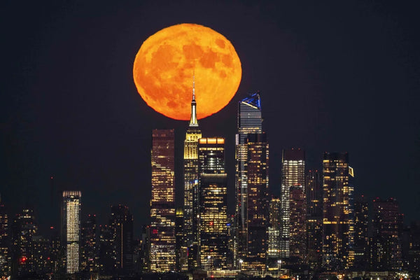 The supermoon rises over New York City on Tuesday.Fatih Atkas / Anadolu Agency via Getty Images