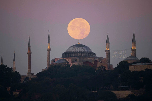 The sturgeon supermoon over the Hagia Sophia grand mosque in Istanbul early Wednesday. Yasin Akgul / AFP - Getty Images