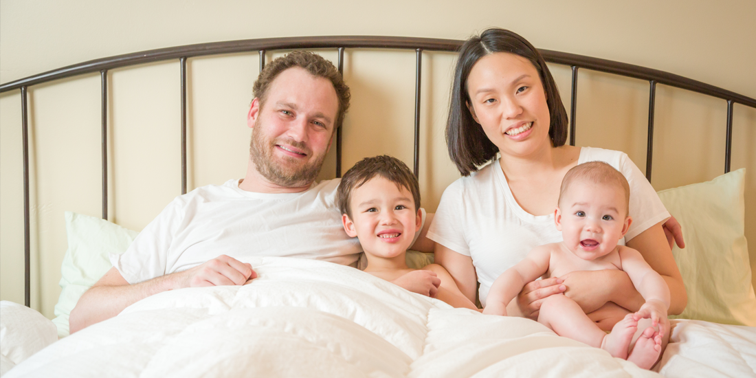 Dad in Bed with family