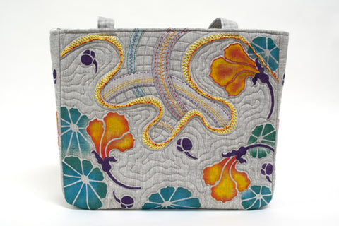 A hand painted and embroidered linen bag using the Nasturtium Stencil by Sproule Studios.