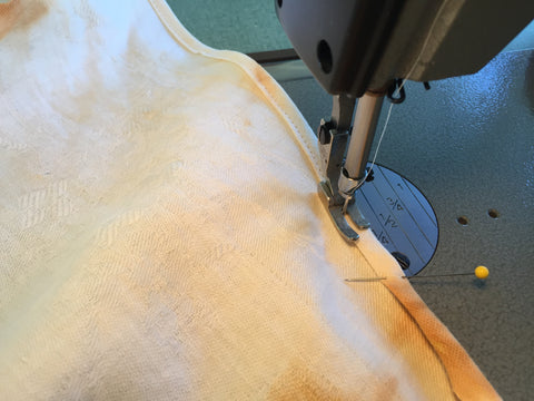 Stitching a curved hem with a double fold with April Sproule.