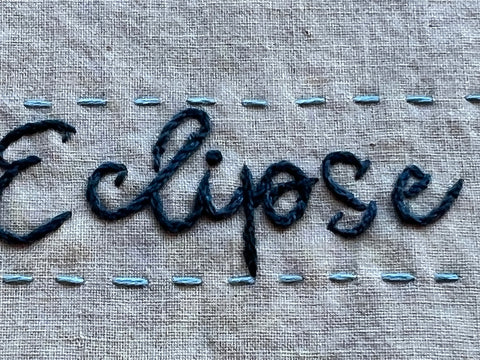 Closeup of hand stitched lettering by April Sporule