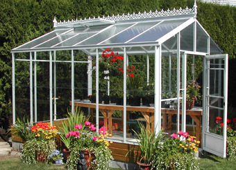 A white-framed Cross Country greenhouse 
