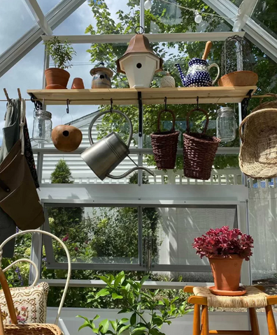 A white-colored Cross Country Parkside greenhouse