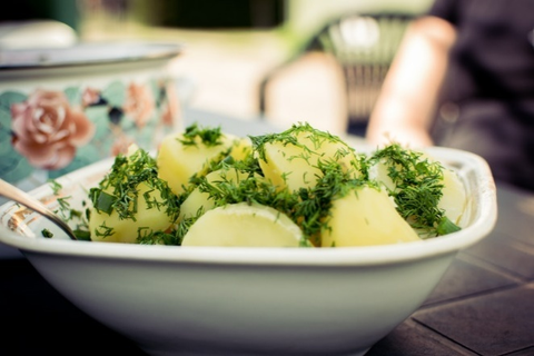 Fresh dill sprinkled on potatoes