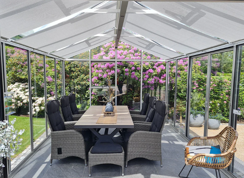 a Livingten greenhouse with indoor seating